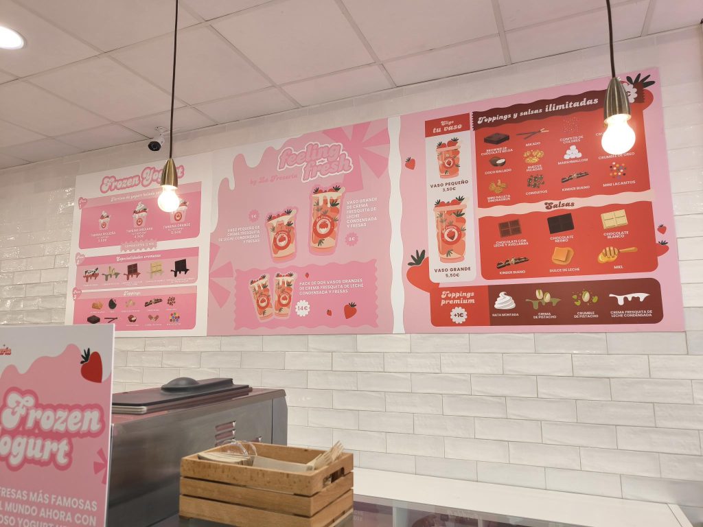 Vinilos decorativos personalizados instalados en escaparate de tienda en Sagunto